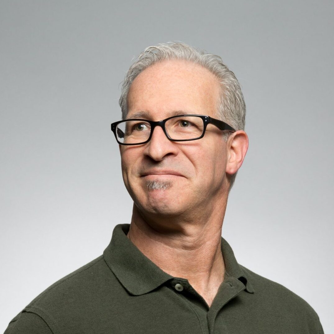 man wearing green polo shirt